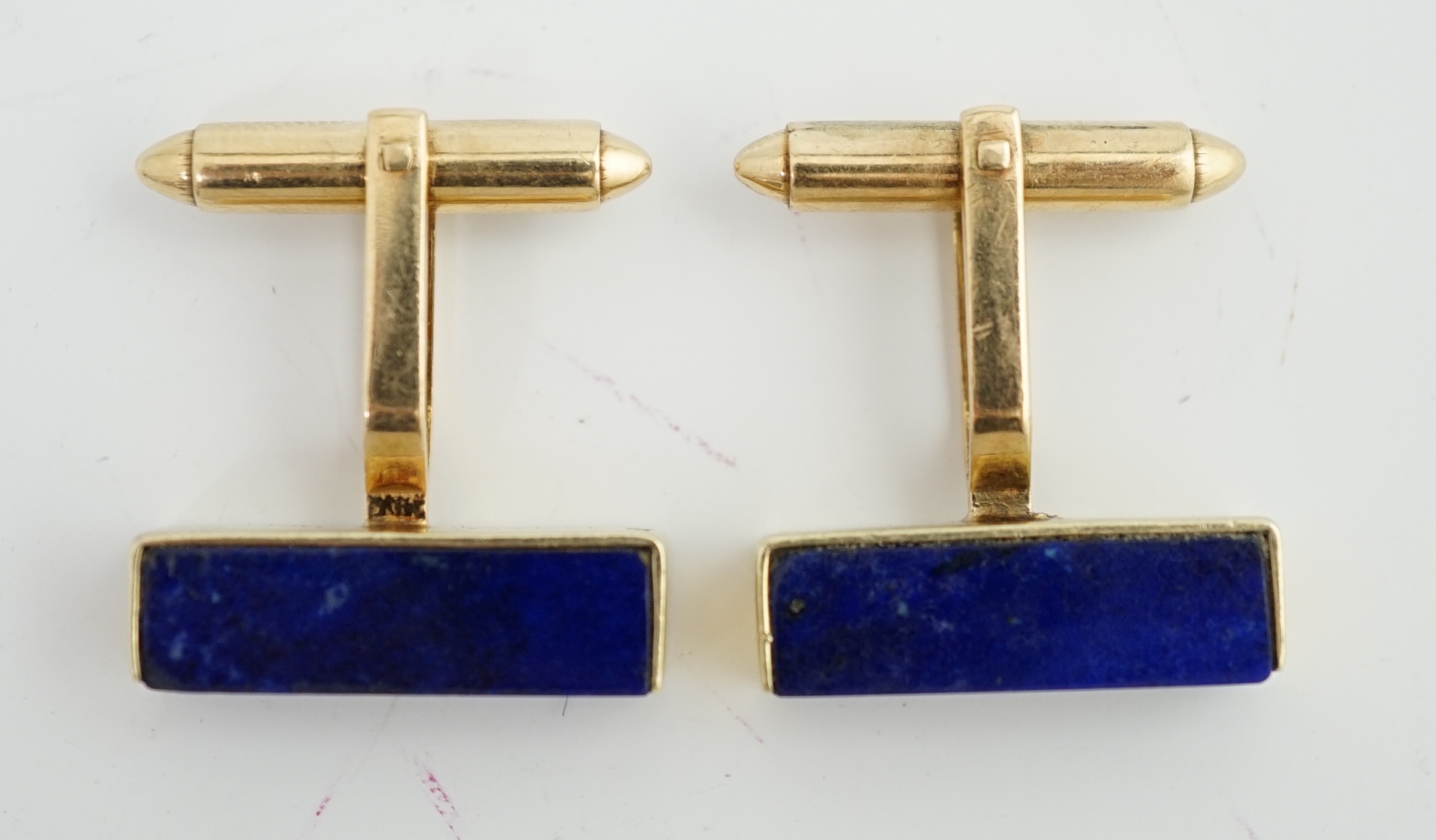 A pair of mid to late 20th century 14k gold and lapis lazuli set cufflinks